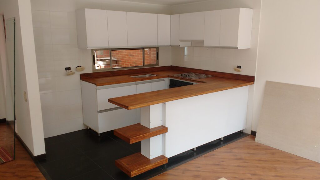 Cocinas integrales, Muebles para baños en Bogotá, Colombia. Cúbiko Arquitectura. Diseño de todo tipo de muebles, mobiliario, carpintería arquitectónica, remodelaciones y obra civil en Bogotá, Colombia. Proyectos en el hogar, comercial y empresarial. Closets, Mobiliario para oficinas, Centros de entretenimiento, Puertas entamboradas y macizas, Decoración y manejo de maderas Contrachapadas. Asesoría en diseño y arquitectura interior, Presentación de planos técnicos, Mobiliario, Ebanistería, Remodelaciones, Renders. Diseñamos Espacios comerciales para Locales, Vivienda, Oficinas. Obras civiles, Reparaciones locativas, Fabricación y montaje de estructuras metálicas, Fabricación y montaje de divisiones para oficinas en vidrio y acero inoxidable, Mobiliario en acero inox, Mobiliario y superficies en resina acrilica corian. Diseño de muebles y mobiliario para Sector educativo y Sector salud. Impermeabilizaciones.